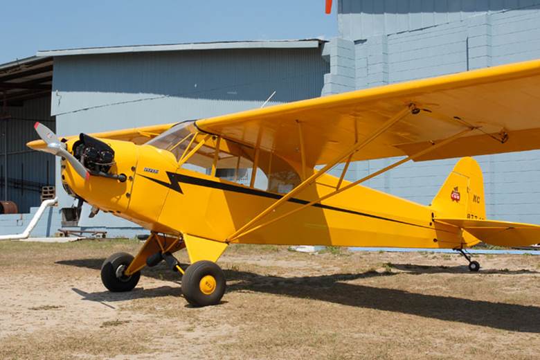 A picture containing plane, yellow, sky, outdoor

Description automatically generated